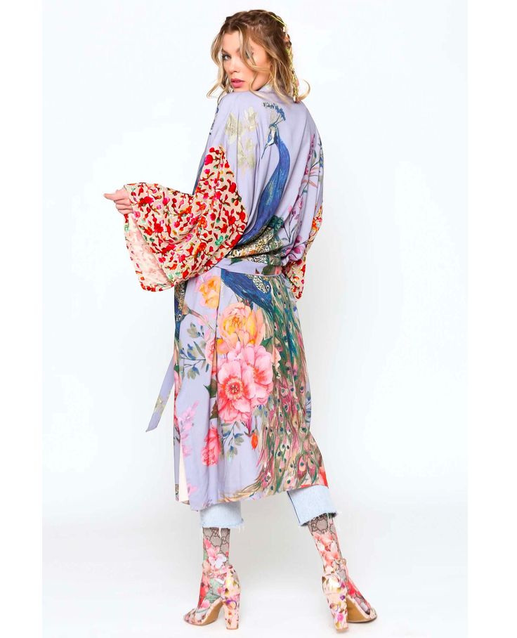 Be unique. Be YOUtiful! The fantasy kimono features a beautiful peacock print in a longline, silky design with slightly sheer floral design sleeve and tie closure at the waist for added shape. Lined & belted peacock floral print kimono with burnout velvet sleeves Blue peacock print Dry clean Self: 100% rayon & contrast: viscose/nylon Summer Silk Kimono With Tie Waist, Multicolor Silk Robe For Spring, Spring Silk Wrap Robe, Fitted Wrap Kimono For Spring, Spring Fitted Wrap Kimono, Spring Silk Kimono With Kimono Sleeves, Spring Silk Kimono With Tie Waist, Silk Spring Kimono With Tie Waist, Silk Kimono With Tie Waist For Spring