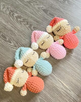 small crocheted stuffed animals laying on top of a wooden floor