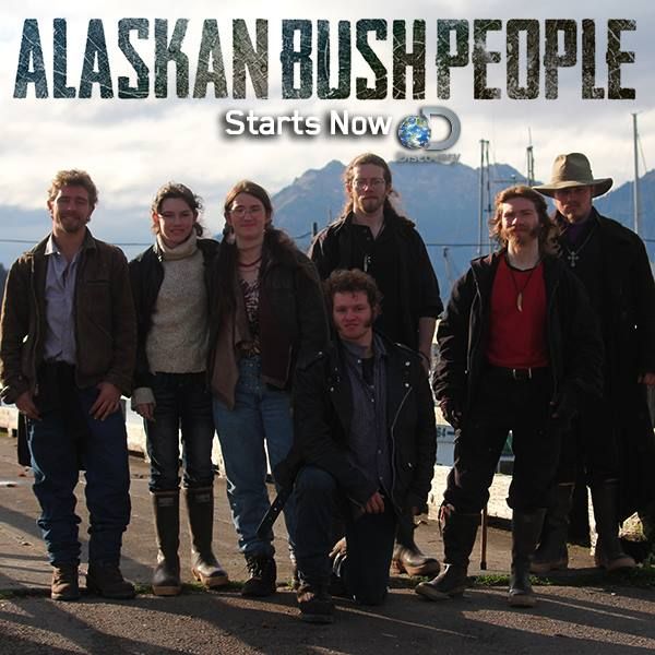 a group of people standing next to each other in front of the alaskan bush people logo