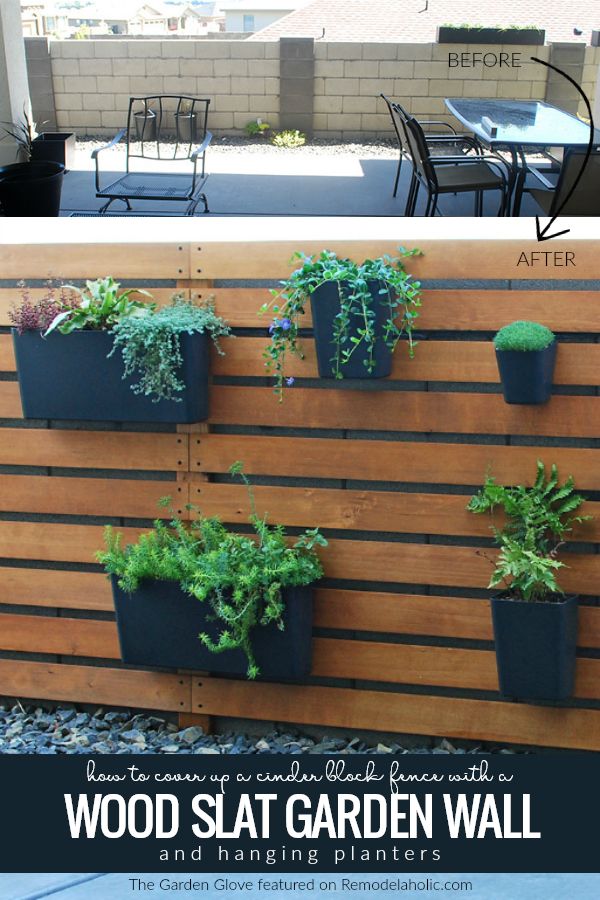 a wooden slat garden wall with plants growing on it and text overlay that reads how to create a vertical wood slat garden wall