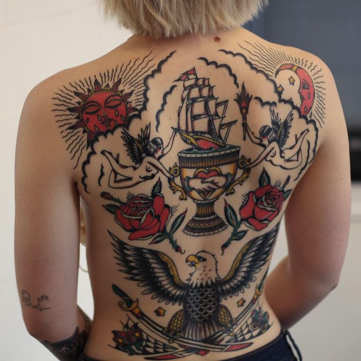 the back of a woman's body with tattoos on her upper and lower half