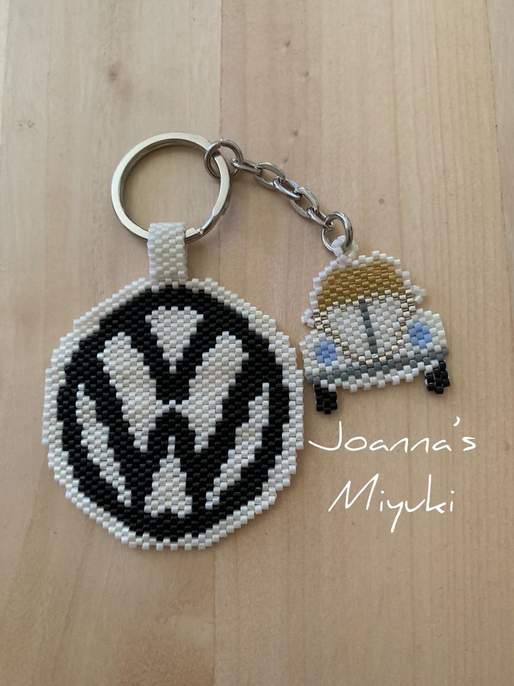 a beaded keychain with a volkswagen emblem on it