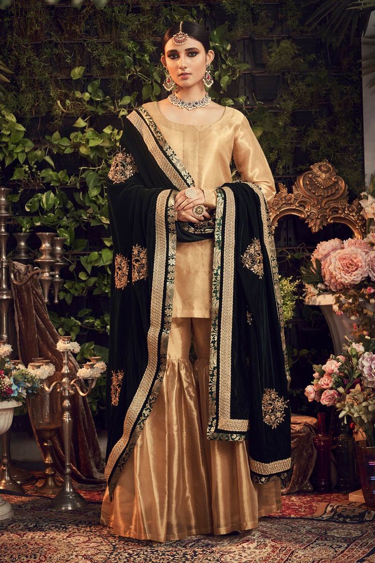 Oxidised gold kurta with embroidered neckline, cuffs and comes with gharara. Paired with silk velvet floral embroidered green dupatta.
Component: 3
Embroidered
Neckine: Round
Sleeve Length: Full
Fabric: Silk Tissue, Silk Velvet
Color: Gold
Embroidered dupatta
Zardosi embroidery - Aza Fashions Tissue Kurta, Gharara Designs, Black Dupatta, Velvet Dupatta, Zardosi Embroidery, Stylish Kurtis Design, Velvet Dress Designs, Velvet Shawl, Bridal Dress Fashion