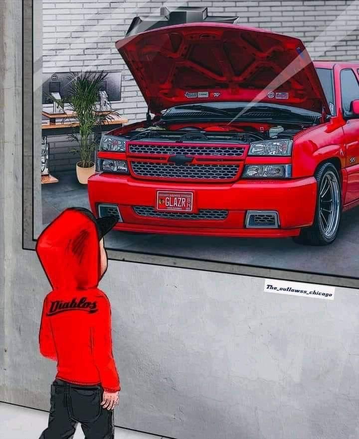 a child looking at a painting of a red car