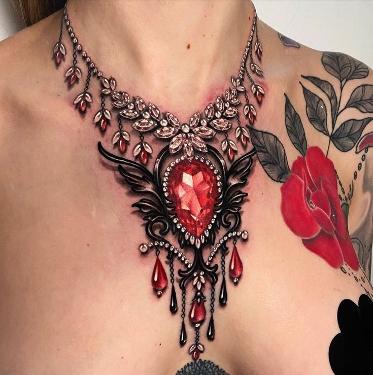 a close up of a woman's chest with tattoos and jewelry on her chest