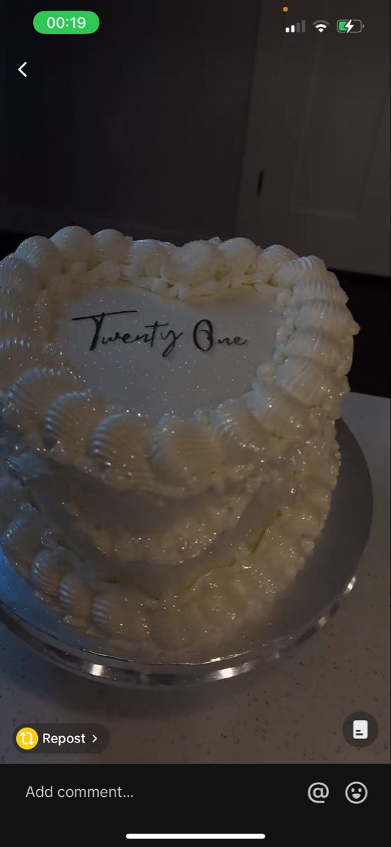 there is a white cake with frosting on the top that says, twenty one