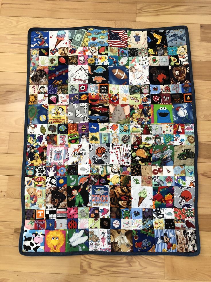 a quilt made up of many different pictures on the floor with wood floors in the background