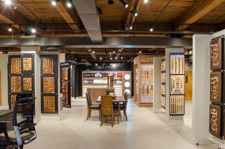 a room filled with lots of furniture and walls covered in wooden plaques on the wall