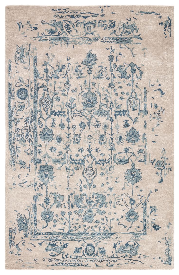 an area rug with blue and white designs on it