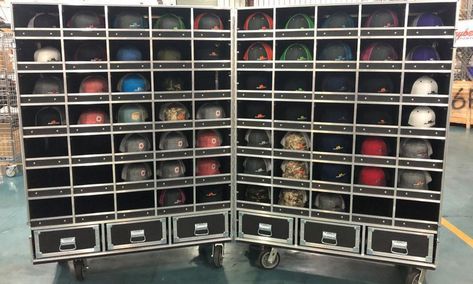 several metal bins are stacked on top of each other in a storage area at a store