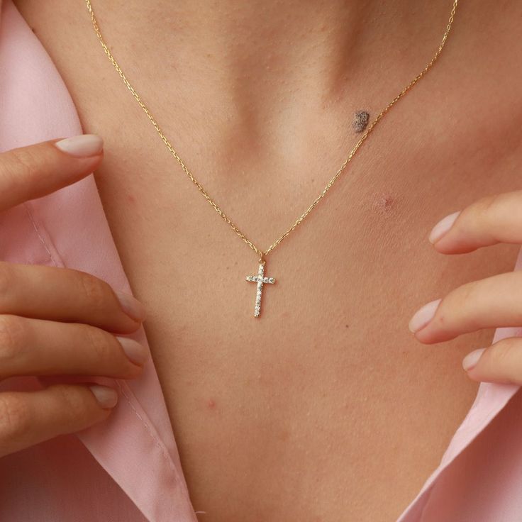 Add a touch of elegance to your outfit with our Cross Necklace with Stones. Perfect for any special occasion, this beautiful necklace features a stunning design and is a great addition to any jewelry collection. It also makes for a meaningful gift for a Goddaughter, as a Communion or Confirmation gift, or for anyone who loves Cross jewelry. Get yours today and inspire your faith! 14k Gold Cross Necklace For Baptism, Minimalist Cross Pendant Necklaces For Baptism, Minimalist Cross Pendant Necklace For Baptism, Gold Cross Pendant Necklace For Baptism, Personalized Cross Necklaces For Baptism, Number Jewelry, Personalised Jewellery Necklaces, Shiny Jewelry, Customer Gifts