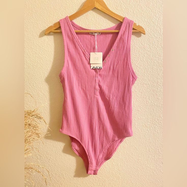 Brand: Zara Size: Women’s Xl Brand New With Tags, Never Worn Pink Ribbed Bodysuit By Zara! So Cute And Fun! Has Functional Snaps On The Front And At Lower Area. Perfect Condition! Bubblegum Barbie Pink Color In Person. Pet Free, Smoke Free Home Same Day Shipping, Or By Next Morning Bodysuit Zara Nwt Cute Bodysuit Snatched Ribbed Bubblegum Pink Pink Tank Womens Bodysuit Fitted Zara Pink Tank Top, Zara Sleeveless Lined Bodysuit, Zara Stretch One-piece Bodysuit, Barbie Pink Color, Zara V-neck Summer Bodysuit, Chic Zara V-neck Bodysuit, Pink Ribbed, Ribbed Knit Bodysuit, Knit Bodysuit