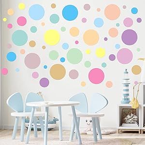 a child's room with colorful polka dot wall decals on the walls and chairs