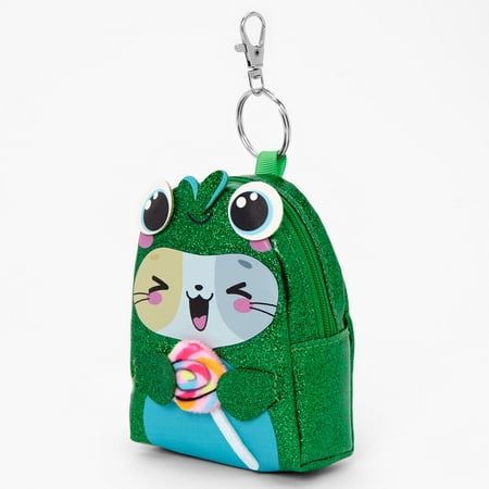 This blushin' kitty Polyurethane Multicolor keychain is in the shape of a mini backpack to store small items such as money, lip balms, jewelry, and more. A keyring is attached to hook it onto your bag and take it wherever you go! Attached metal keyring Dimensions: 3" W x 3.5" H x 2" D Closure: Zip Material: PU - Claire's Glitter Frog Costume Cat Mini Backpack Keychain Gender: female.  Age Group: adult. Mini Backpack Keychain, Frog Costume, Backpack Keychain, Coin Purse Keychain, Girls Keychain, Best Friend Challenges, Friend Challenges, Crochet Keychain Pattern, Backpack Keychains