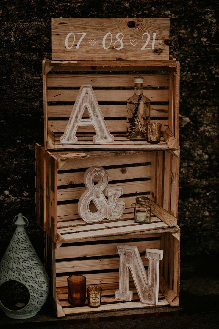 wooden crates with letters and numbers on them