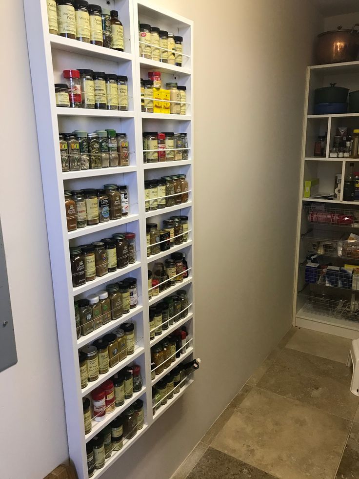 the pantry is stocked with many different types of spices and condiments to choose from