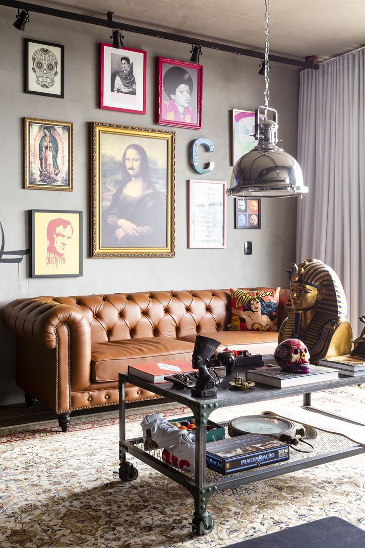 a living room filled with lots of furniture and pictures on the wall above it's coffee table