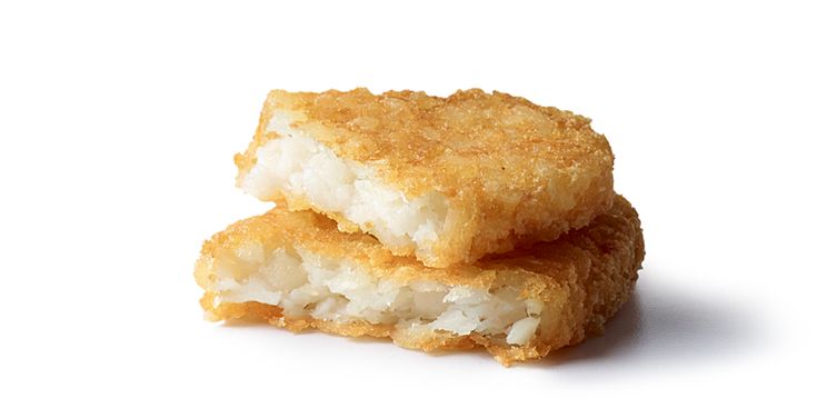 two fried food items stacked on top of each other in front of a white background