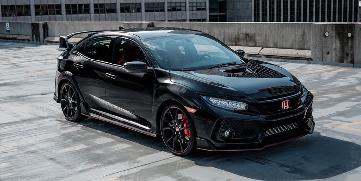 a black car parked in front of a building