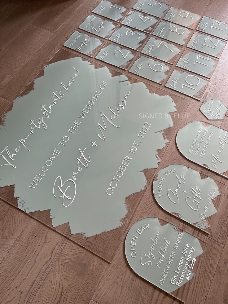 several pieces of glass sitting on top of a wooden floor next to some cut outs