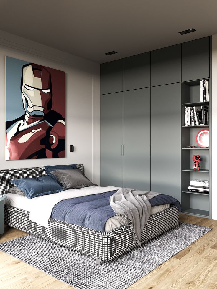 a bedroom with a bed, bookshelf and pictures on the wall