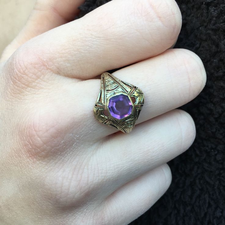 Details: Victorian 14K gold Art Deco amethyst ring circa 1930's. Beautiful deco design, with leaf inspired pattern. The lovely amethyst measures 6.7mm x 6.7mm, and sits about 5.5mm from the finger. The setting measures 15.4mm from top to bottom. The ring is in excellent condition. Please ask all necessary questions prior to placing an order. Measurements: The size is 7 US and can be sized for a fee. Condition: The overall all condition of this ring is excellent condition and the stone is securel Antique 14k Gold Amethyst Ring, Heirloom Amethyst Birthstone Ring, Art Deco Amethyst Ring In Yellow Gold, Art Deco Yellow Gold Amethyst Ring, Art Deco Oval Purple Amethyst Ring, Yellow Gold Amethyst Ring In Art Deco Style, Vintage Yellow Gold Amethyst Ring, Gold Heirloom Amethyst Birthstone Ring, Heirloom 14k Gold Purple Birthstone Ring