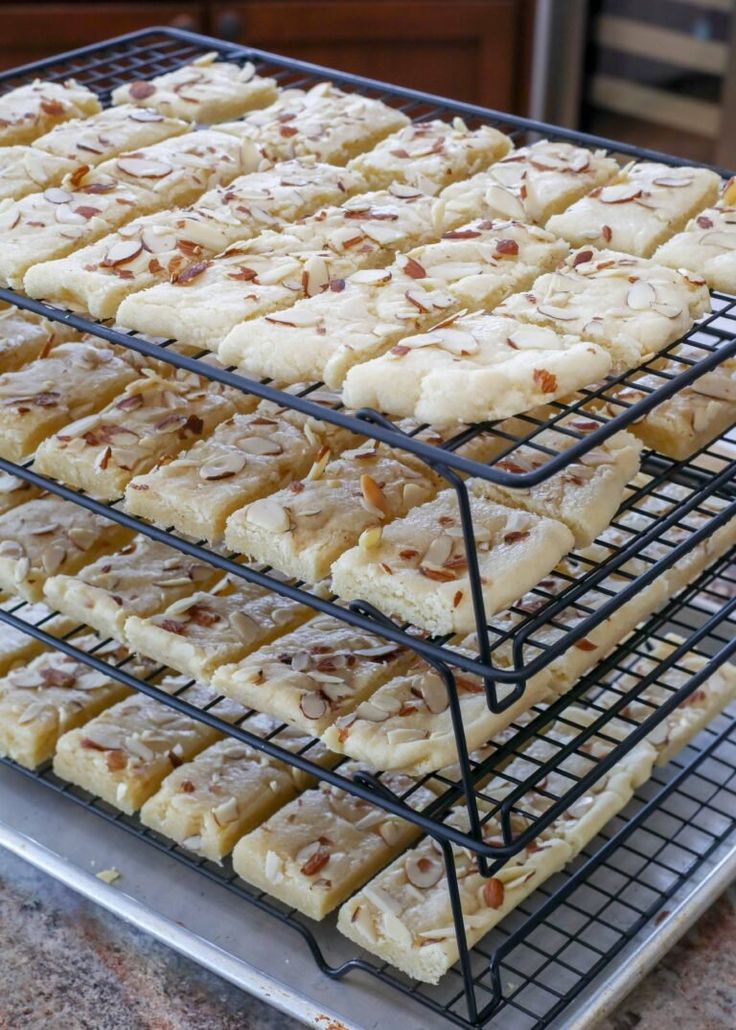 several trays filled with different types of food on top of a counter next to each other