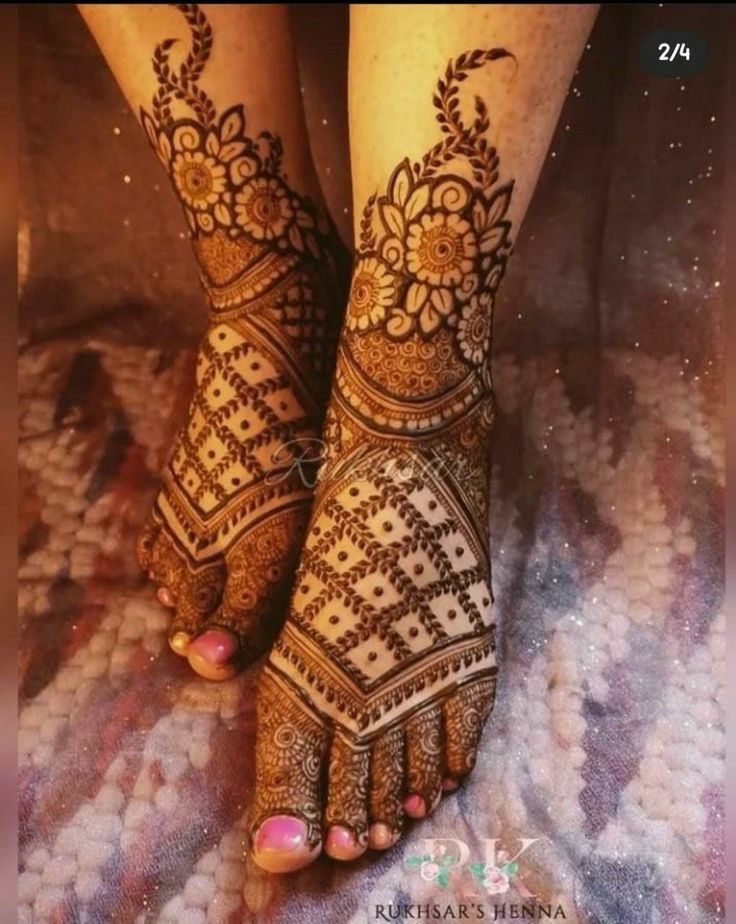 the legs and feet of a woman with henna tattoos