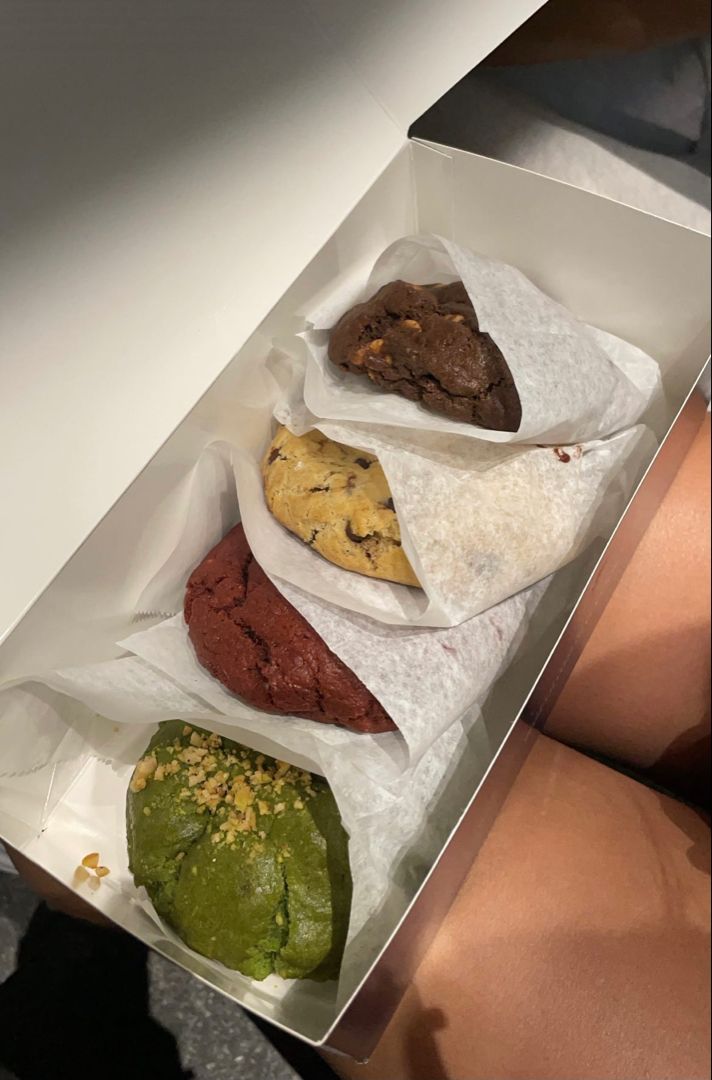 a box filled with different types of cookies