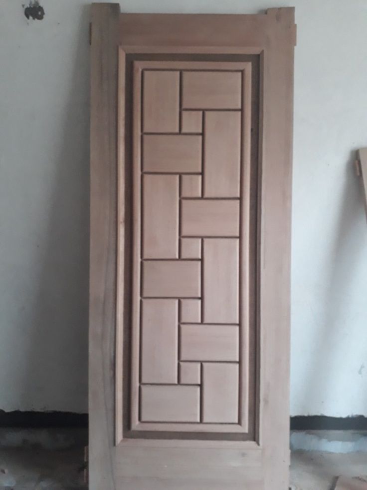 an unfinished wooden door in the process of being painted