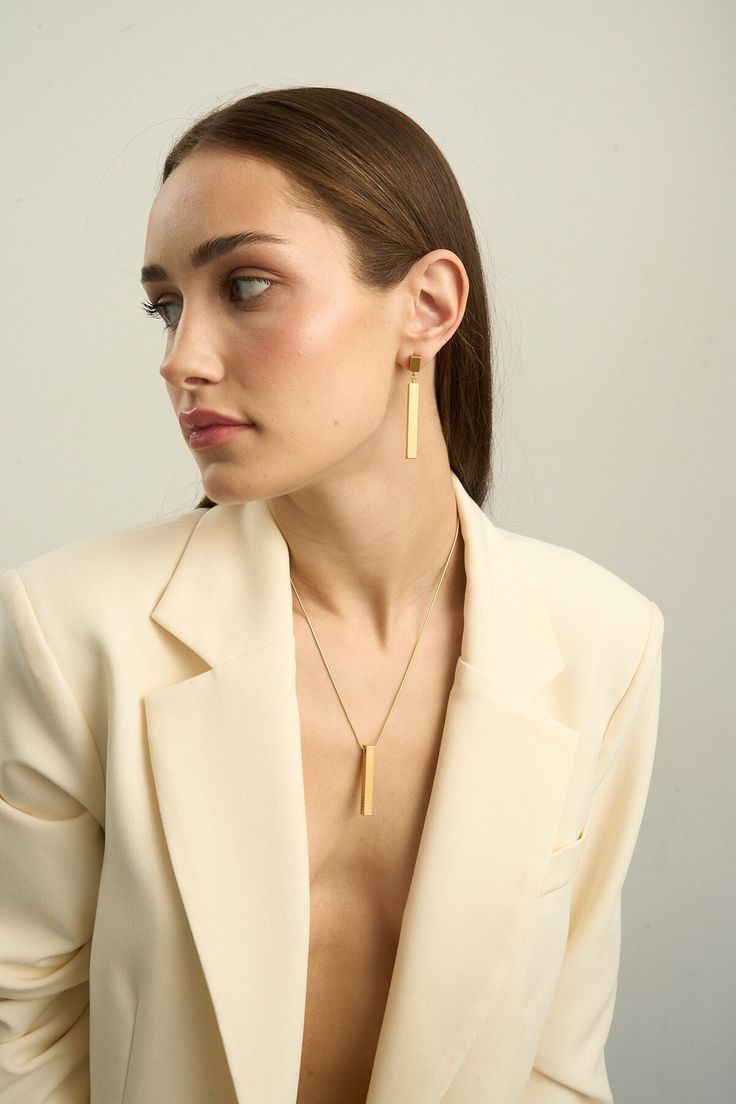 The STILL Jewelry collection of 24k gold-plated jewelry is the epitome of modern elegance and minimalism. The sophisticated design, featuring a vertical long rectangle, gives the jewelry a stylish and restrained look, making it a versatile accessory for any outfit. This collection is perfect as a gift for a woman, girlfriend, bestie, sister, wife, or anyone who appreciates refined jewelry. Whether it's for a birthday, prom, anniversary, Valentine's Day, a special event, or simply as a treat for Bar Pendant Necklace, Vertical Bar, Bar Ring, Sister Wife, Bar Bracelets, Bar Pendant, Bar Earrings, Sophisticated Design, Stylish Jewelry