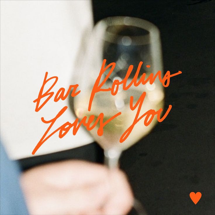 a person holding a wine glass with the words baa follns loves you