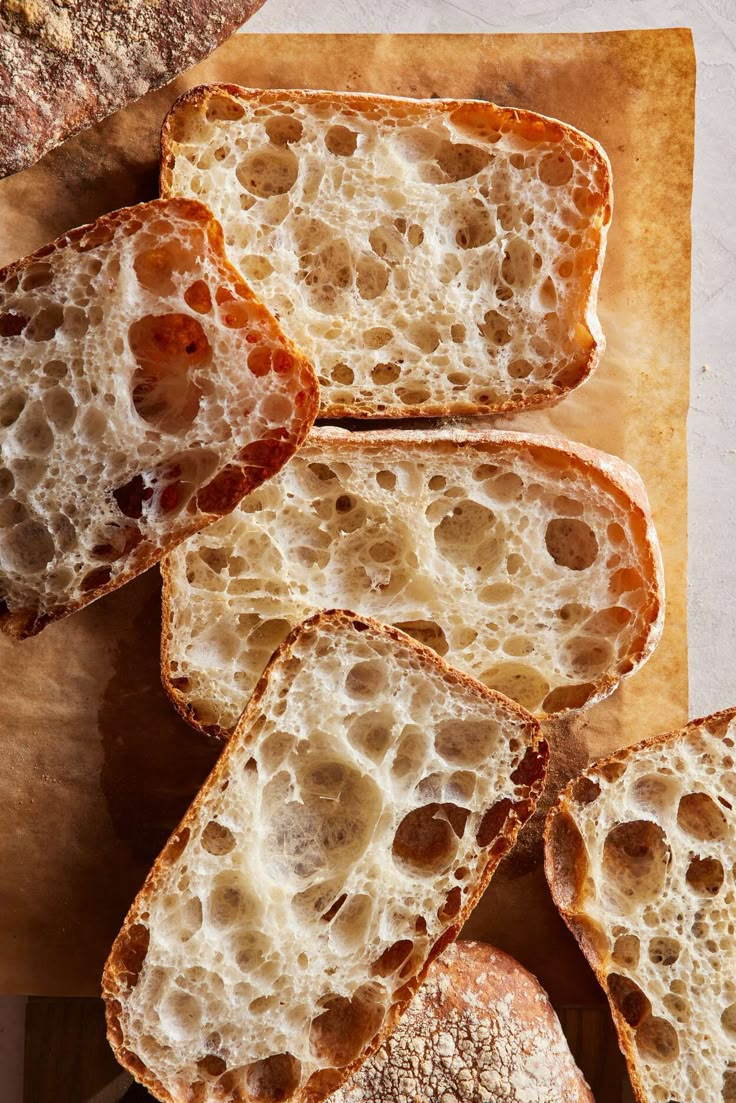 slices of bread sitting on top of a cutting board