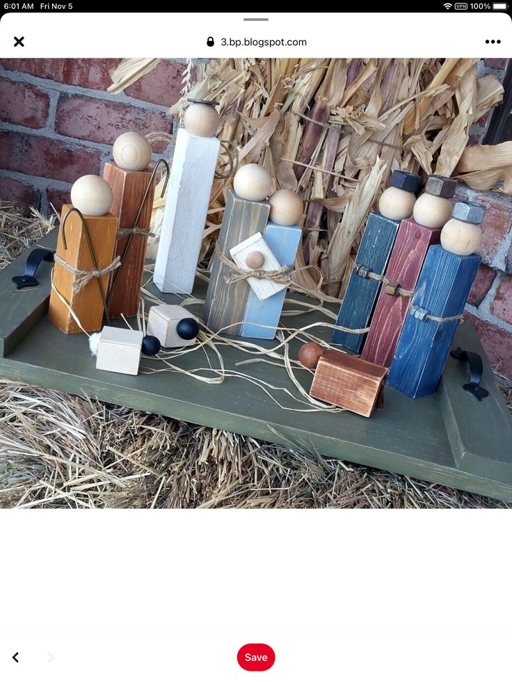 an image of a display with wooden items on the shelf in front of a brick wall