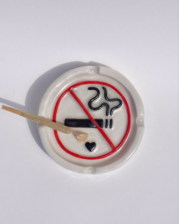 no smoking sign quirky ceramic ash tray, hand built, hand made and  hand painted in the UK. The ideal ashtray to complete your bad girl/ 420 stoner girl aesthetic. Also the perfect handmade gift for any stoner bestie. Find this functional art piece and more on sicalimited.com Functional Hand Built Pottery, Midnight Gospel Ashtray, Ceramic Art Ash Tray, Stone Clay Art, Clay Ashtray For Boyfriend, Pottery Painting Ash Tray, Clay Ash Trays Aesthetic, Y2k Ashtray, Hand Painted Ashtray