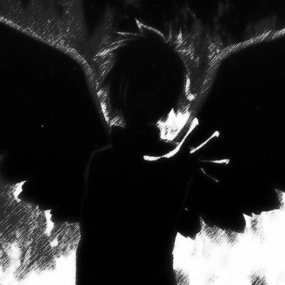 a black and white photo of an angel