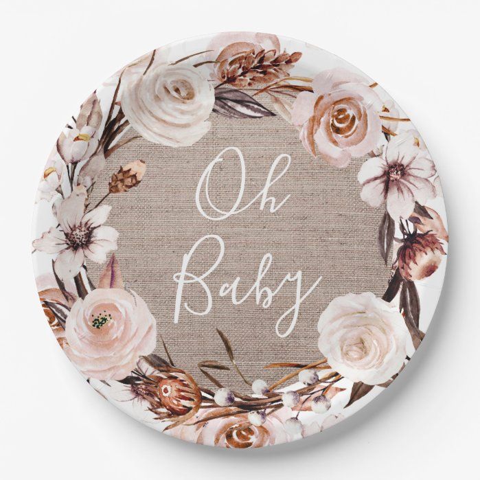 a round plate with flowers and the words oh baby on it's front side