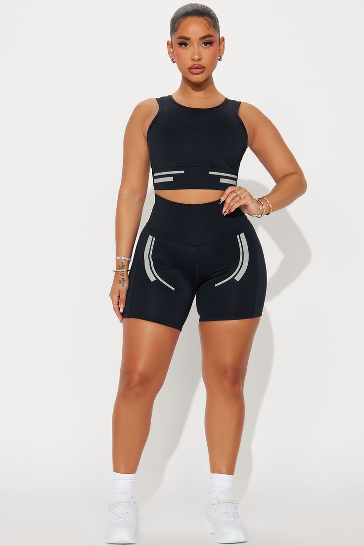 Available In Black. Active Top Scoop Neck Sleeveless Padded Cropped Active Biker Short High Waisted, Elastic Waistband Elevate Reflective Detail High Performance Stretch Body: 73% Polyester 27% Spandex Inner Mesh: 82% Nylon 18% Spandex Imported | Sprint Reflective Elevate Active Set in Black size XS by Fashion Nova Black Compression Tank Top With Built-in Bra, Black Seamless Athleisure Tank Top, Black Seamless Tank Top For Workout, Black Seamless Workout Tank Top, Black Sporty Seamless Tank Top, Black Compressive Crop Top For Summer, Sleeveless Black Seamless Activewear, Black Seamless Tank Top For Training, Black Seamless Tank Activewear