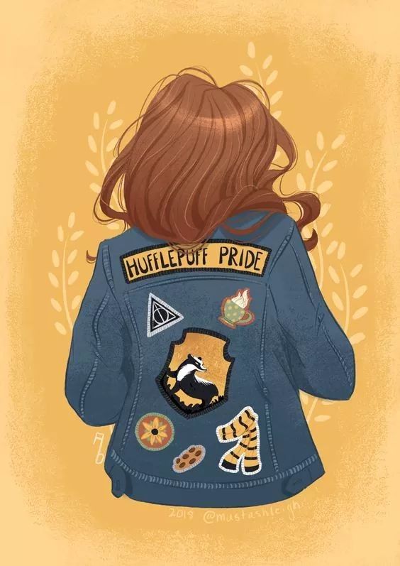 the back of a woman's jacket with patches on it, which reads wildlife pride