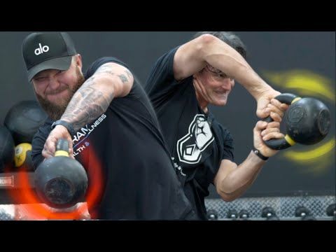 two men are doing exercises with kettles