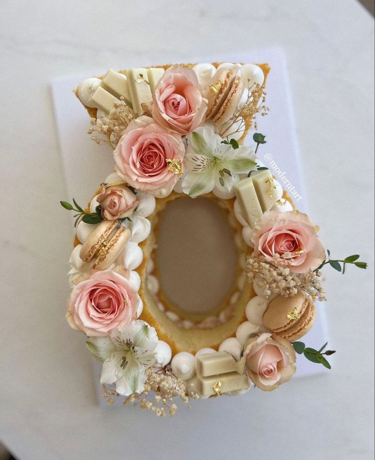 a cake decorated with flowers on top of a table