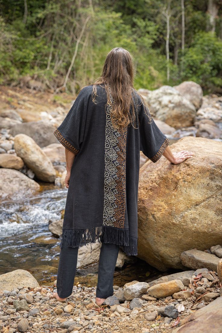 Our handmade BUNTU tribal African simple kimono is a unique and one-of-a-kind piece that is sure to add some flair to your wardrobe. Made of 100% textured cotton, it is comfortable and breathable, perfect for any occasion. The intricate tribal patterns are hand-drawn and carefully crafted, giving the kimono a traditional and authentic touch. Whether you're wearing it for a casual outing or a special ceremony, this kimono is sure to be your ideal companion . . . One size fits most . . . Measureme Mens Summer Streetwear, Simple Kimono, Mens Kimono Jacket, Ritual Clothing, Mens Poncho, Hemp Clothing, Viking Clothing, Festival Pants, Burning Man Outfits