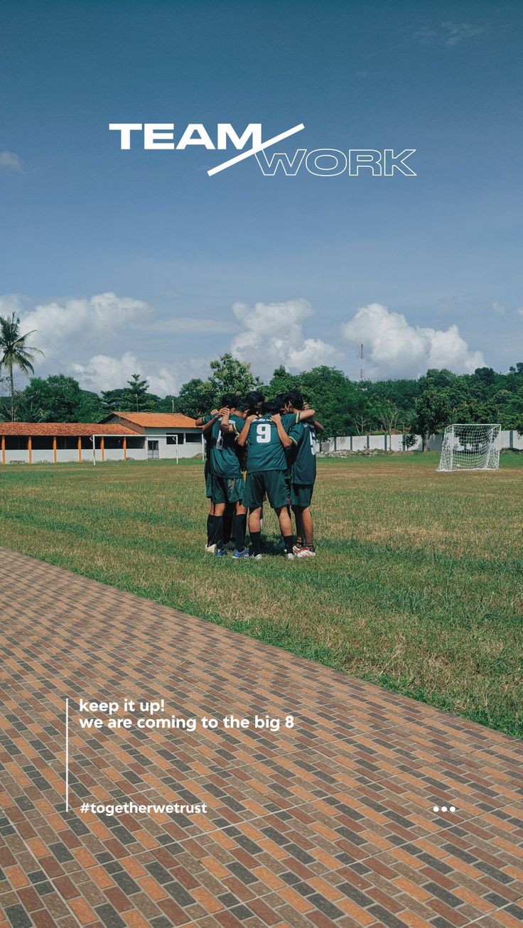 a group of men standing on top of a lush green field