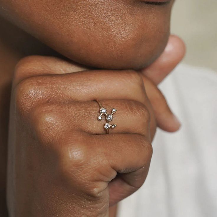 Introducing the Pleiades Ring, a celestial masterpiece that is inspired by the beauty of the Pleiades star cluster. This conceptual constellation ring is perfect for a cosmic inspired unique engagement ring. Crafted with care, it features a diamonds in a constellation design set in fairmined gold. The Pleiades Ring is more than just a piece of jewelry; it symbolizes divine guidance and embodies the magic of the cosmos. Ring cast in 14k fairmined yellow gold, rose gold or white gold and has .225 Celestial Diamond Ring With Accents For Promise, Celestial Style Promise Diamond Ring With Accents, Celestial Promise Ring With Single Cut Diamonds, Celestial Diamond Ring With Vs Clarity For Anniversary, Celestial Rings With Diamond Accents For Promise, Celestial Single Cut Diamond Promise Rings, Celestial Style Promise Rings With Diamond Accents, Celestial Style White Gold Diamond Promise Ring, Celestial Promise Rings With Diamond Accents