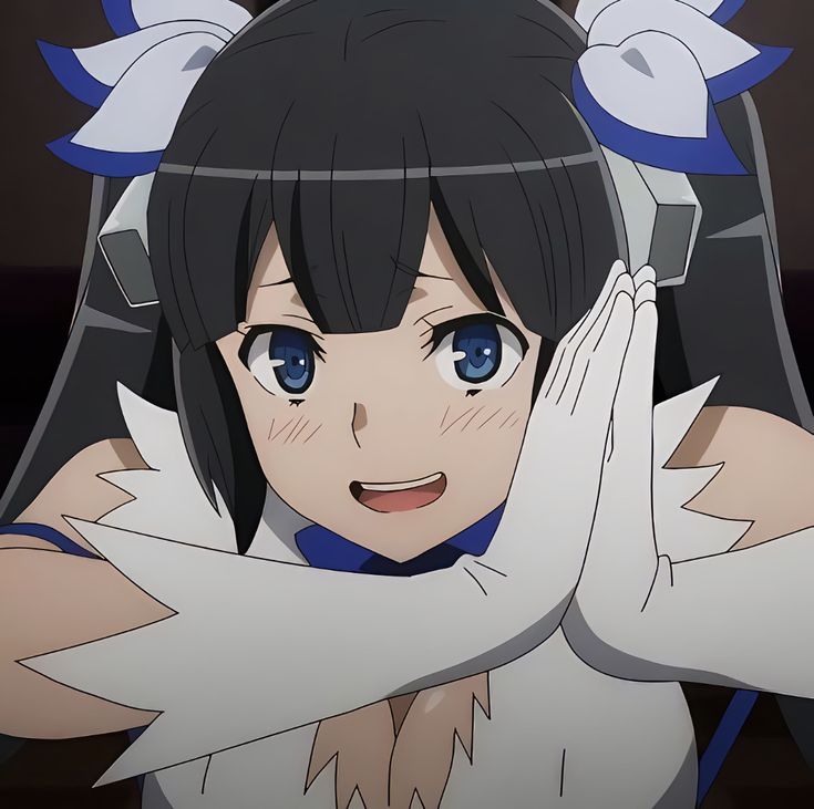 an anime character is holding her hands up to her face and looking at the camera