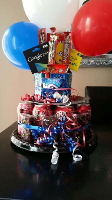 a birthday cake made out of cans and balloons