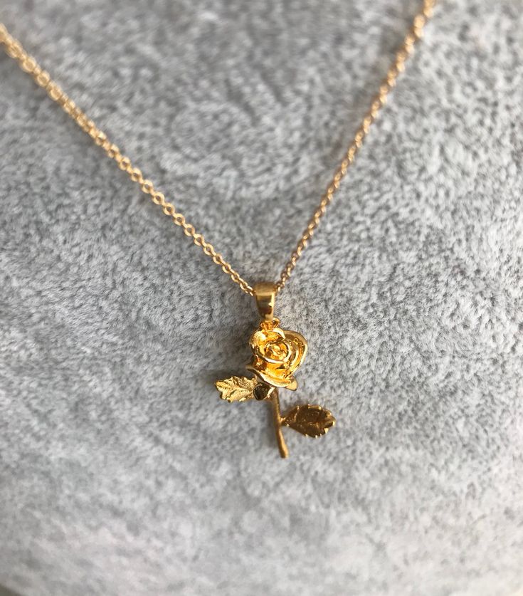 "Gorgeous Rose Necklace! You choose a 16\" or 18\" delicate yet sturdy 14k gold filled chain that holds a detailed rose pendant. (Length pictured is 18\"). On trend, it's my new favorite piece I haven't taken off! Charm measures roughly 17 mm x 40 mm and is 24k gold filled over copper. Excellent detail in this tiny piece! Arrives in a gift box! *if you need an item sooner, please message me! I am happy to ship sooner if I'm able to ❤️" Elegant Gold Necklaces With Rose Details, Elegant Gold Necklaces With Roses, Rose Gold Flower Charm Necklace With Delicate Chain, Delicate Rose Gold Necklaces With Roses, Dainty Flower Necklace With Rose Design, Dainty Rose Gold Necklace With Rose Design, Delicate Gold Jewelry With Rose Design, Gold Elegant Necklace With Rose Design, Elegant Gold Necklace With Rose Design