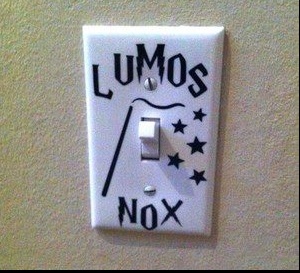 a white light switch with the words lumos nox on it