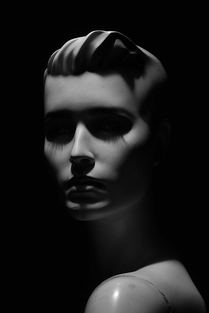 a black and white photo of a mannequin's head