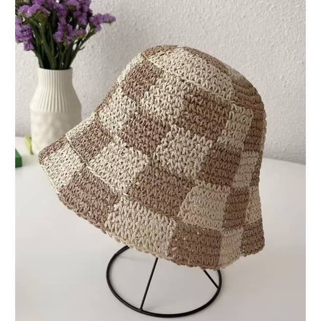 Slay in style with the Checkered Chic Bucket Hat! This trendy straw hat is perfect for any outfit and features an adjustable strap for a perfect fit. Whether you want to rock a cute, chic look or add a touch of playfulness, this bucket hat is a must-have accessory. Trendy Bucket Hat For The Beach, Trendy Beach Bucket Hat One Size Fits Most, Trendy Bucket Hat For Beach, One Size Fits Most, Casual Adjustable Crochet Hat With Woven Details, Casual Adjustable Woven Crochet Hat, Trendy Short Brim Bucket Hat For Beach Season, Trendy Adjustable Bucket Hat For Beach Season, Trendy Beach Hat One Size Fits Most, Trendy Beach Hats One Size Fits Most